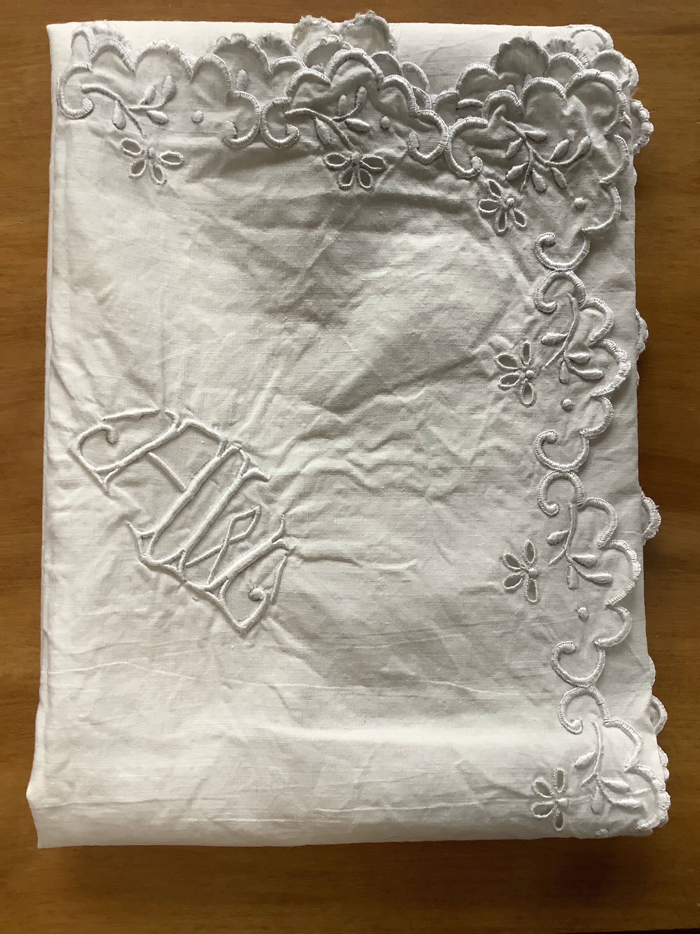 Embroidered table placemat with initials AW