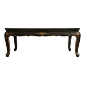 Antique Chinese coffee table in black and gold lacquered wood.