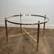 Neoclassical Round Coffee Table in Brass with Fluted Supports and Floral Motifs