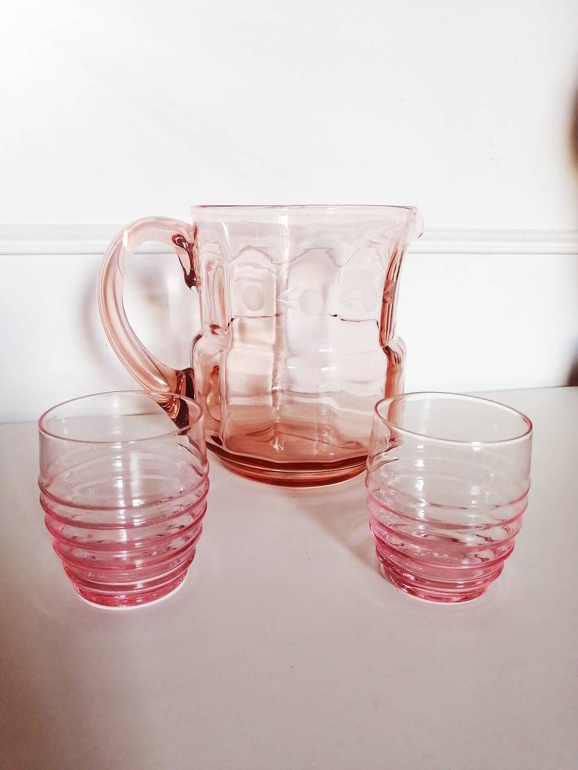 Pitcher and 2 glasses in pink glass