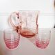 Pitcher and 2 glasses in pink glass