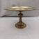 Antique centrepiece on a pedestal in bronze, in very good condition.