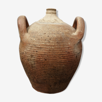 Old terracotta pot with two handles