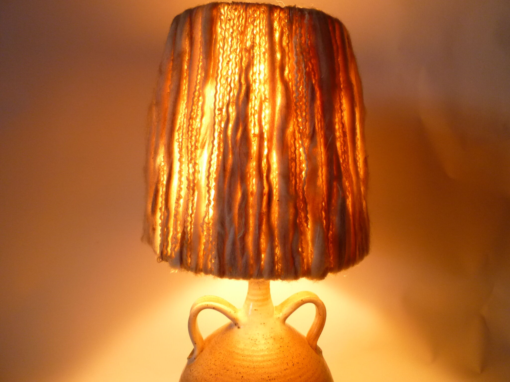 Lamp with sandstone handles