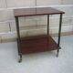 Wooden vintage table on wheels