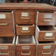 Office furniture has oak drawers 1950 brass handles and label holders
