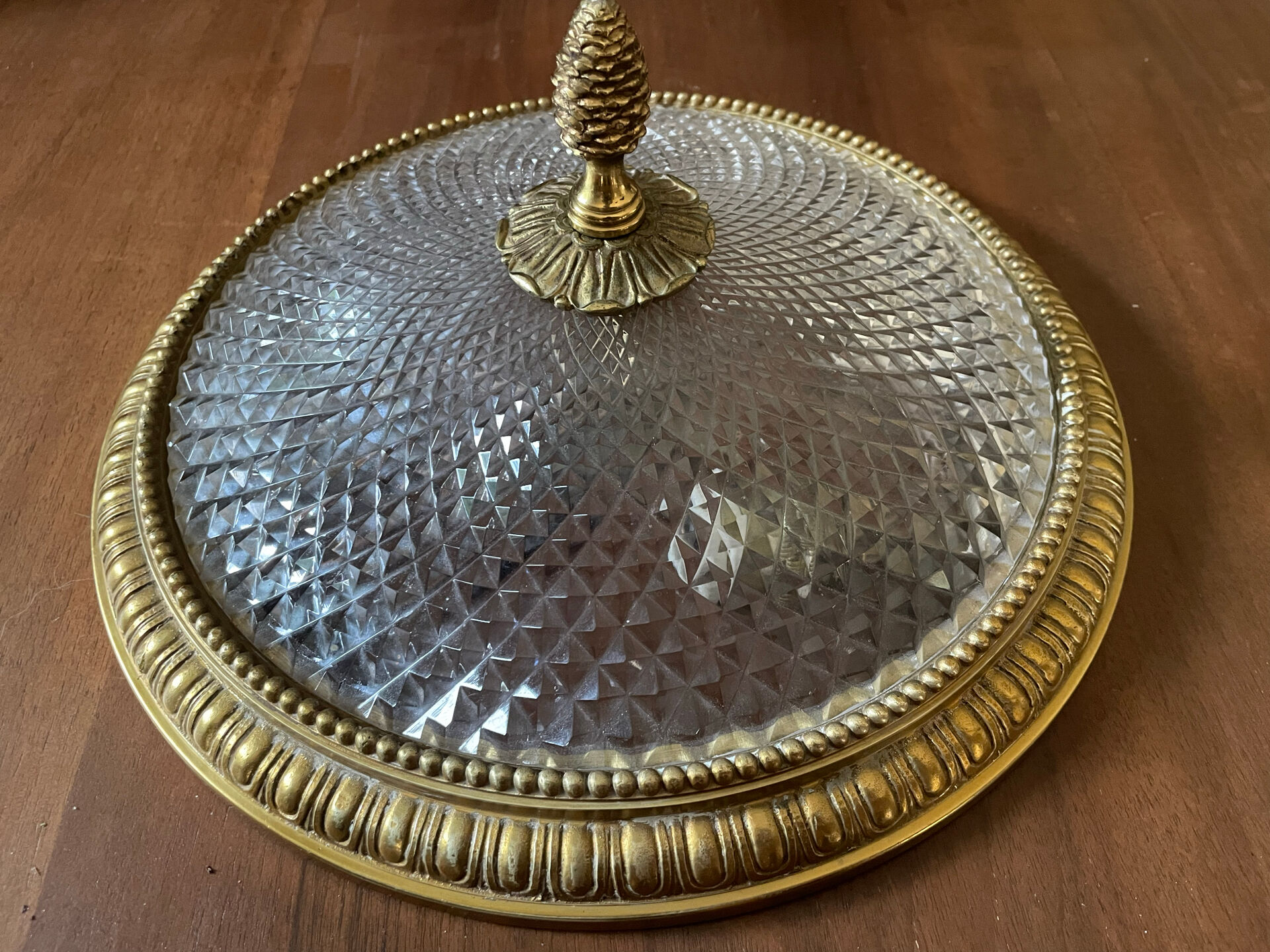 Antique ceiling light in bronze and cut crystal with diamond points.