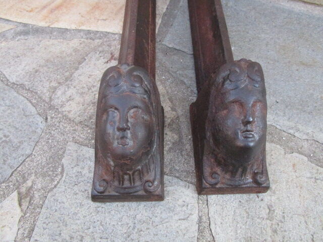 Pair of ancient cast iron channels, antique heads