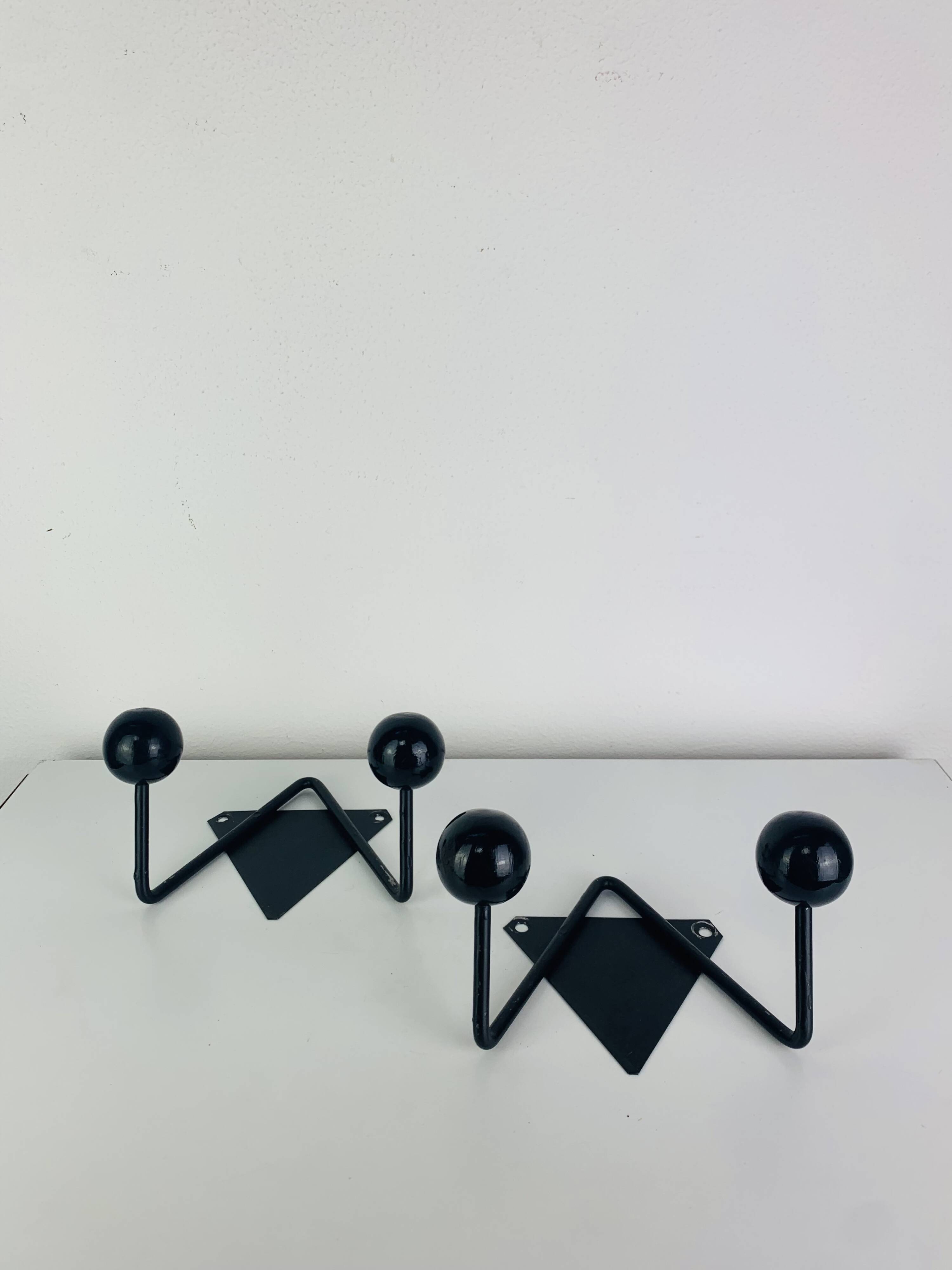 Pair of wall hooks from the 1950s, black metal