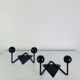 Pair of wall hooks from the 1950s, black metal