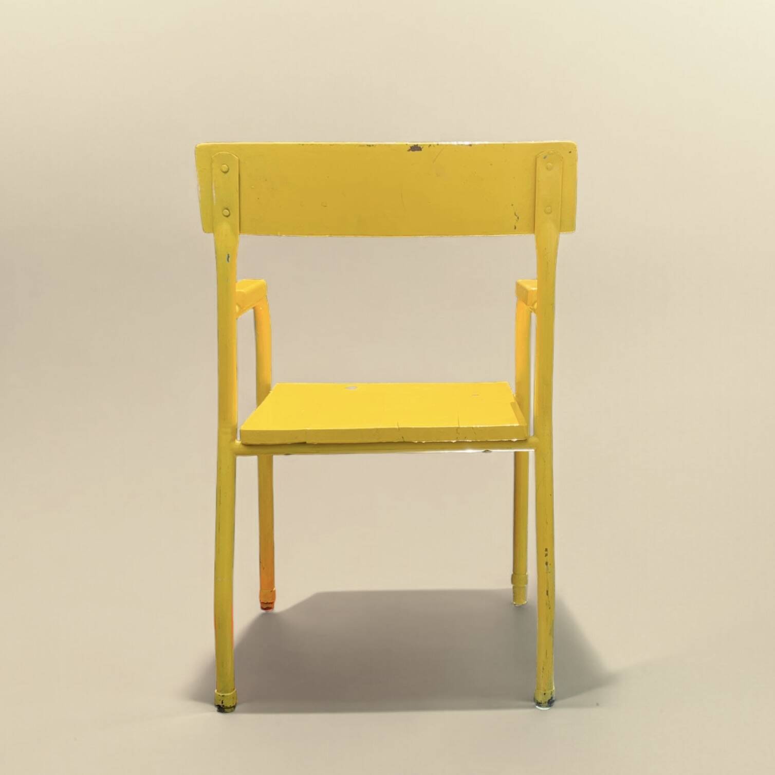 Vintage children's chair in yellow painted wood and metal