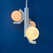 Mid-century white suspension with a bony design and opaline glass shade.