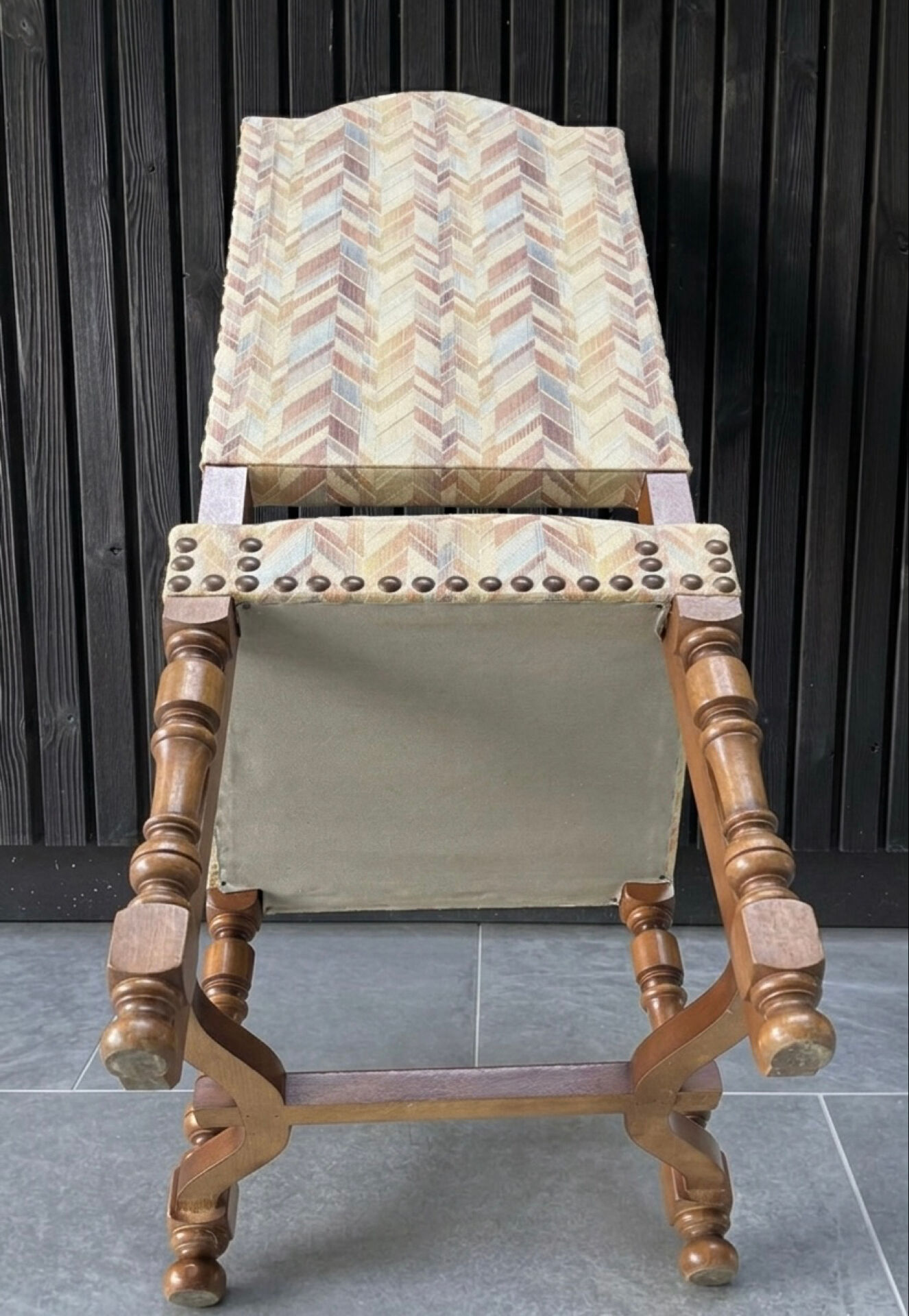 Restored and reupholstered antique chair with character