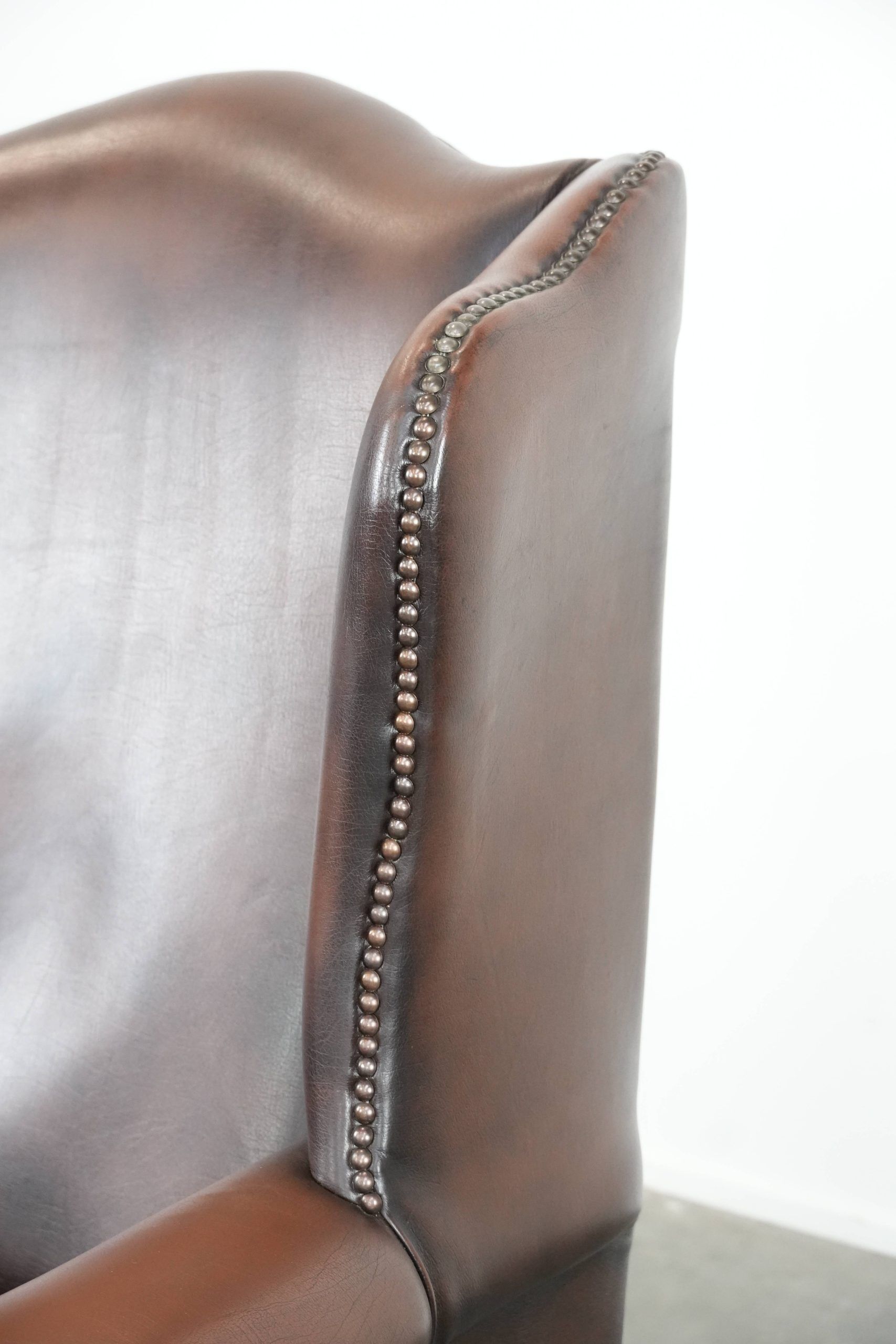 Brown smooth cow leather Chesterfield wingback armchair in English style