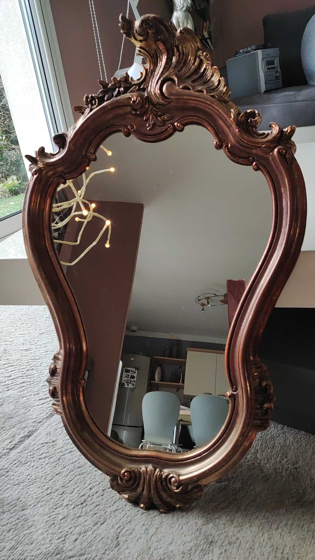 Pretty Baroque style mirror / Louis XV patinated with pink / golden copper reflections. Volutes, leafy shells