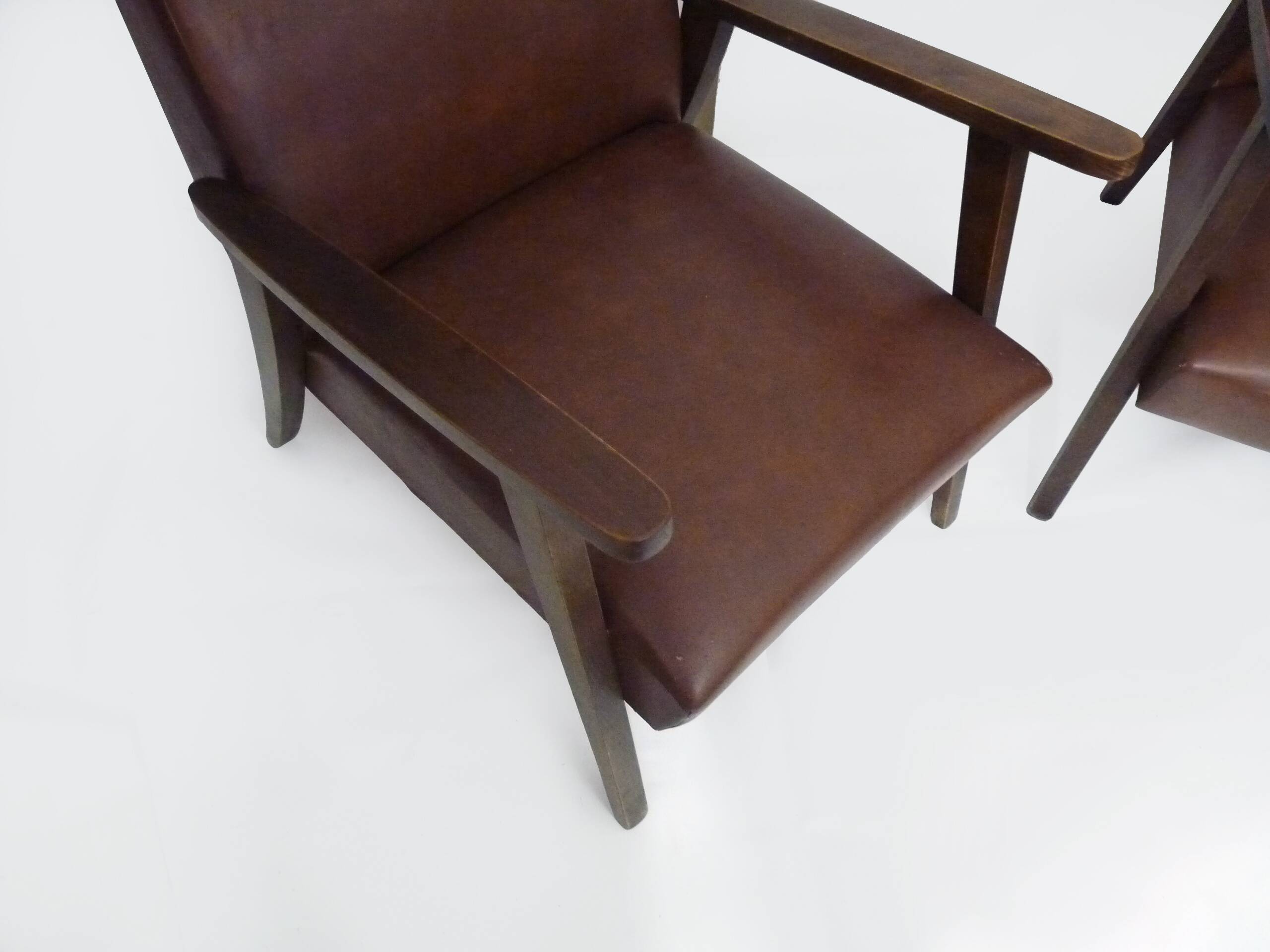 Pair of Scandinavian armchairs in brown leatherette and wood from the 50s and 60s