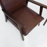 Pair of Scandinavian armchairs in brown leatherette and wood from the 50s and 60s