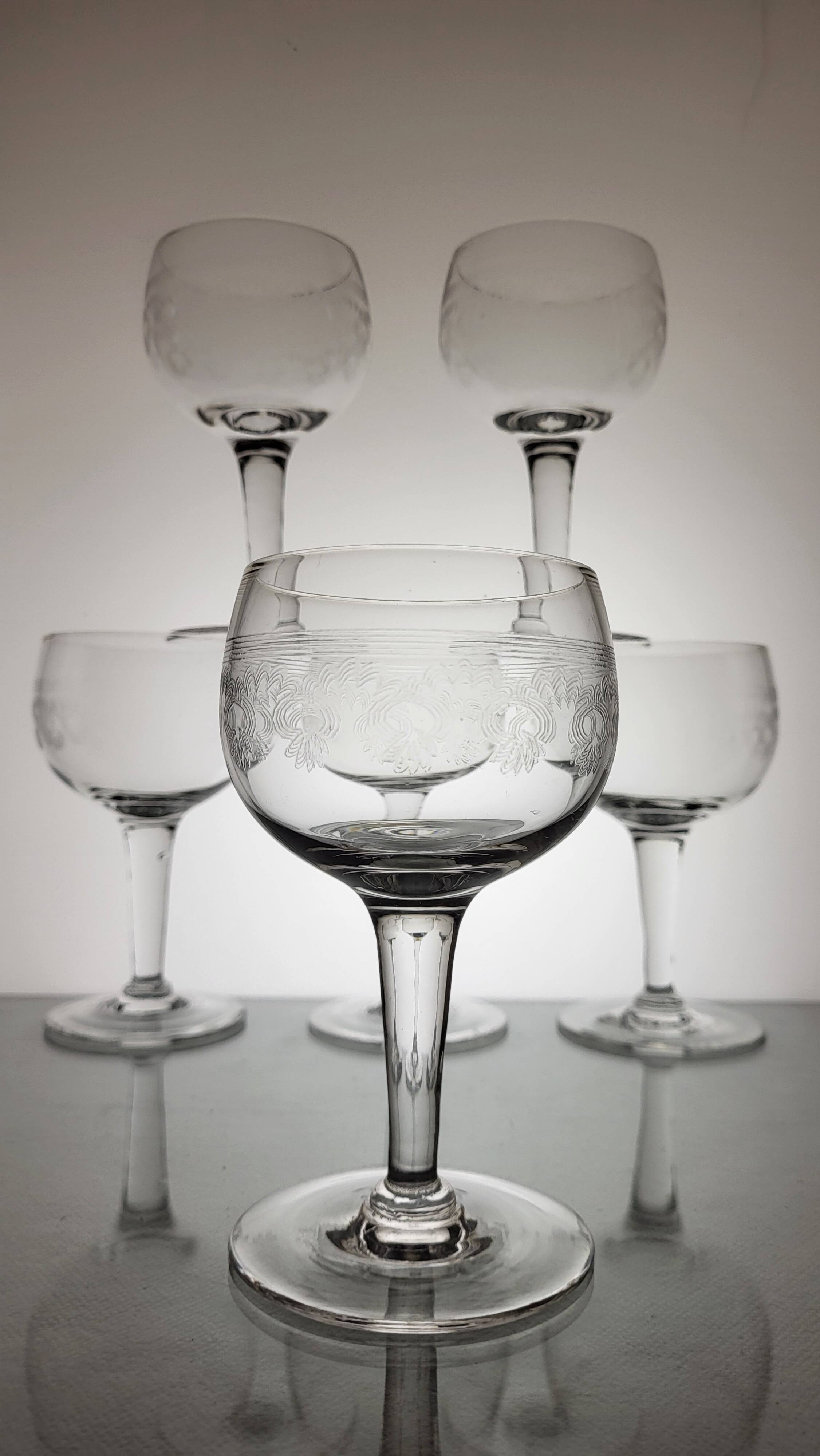 9 guilloche wine glasses, early 20th century
