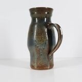 Handcrafted stoneware pitcher with blue-green hues, signed piece