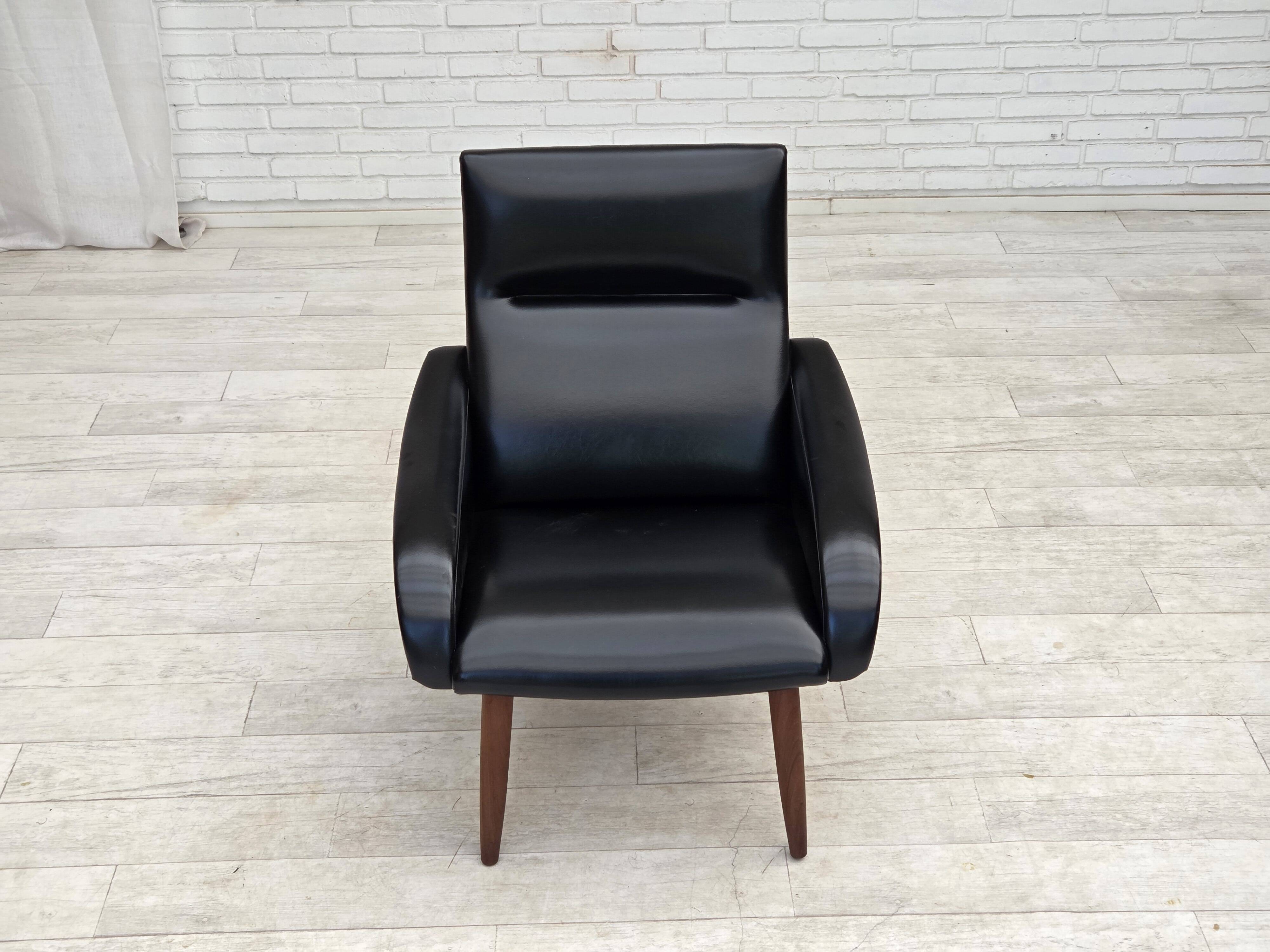 1970s, Danish armchair, black artificial leather, teak wood legs.