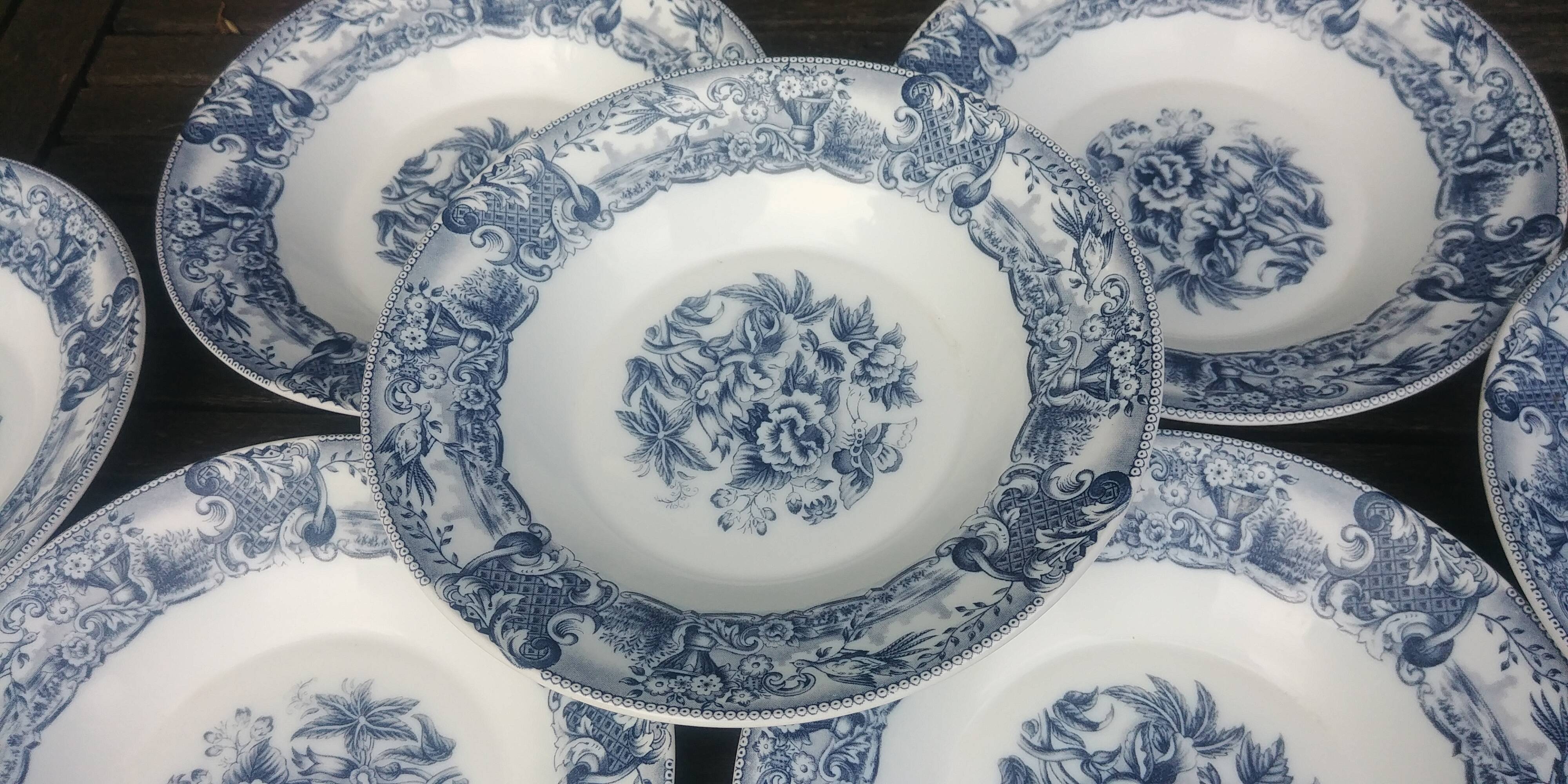 Set of eight hollow plates of the rivanel brand france baroque décor