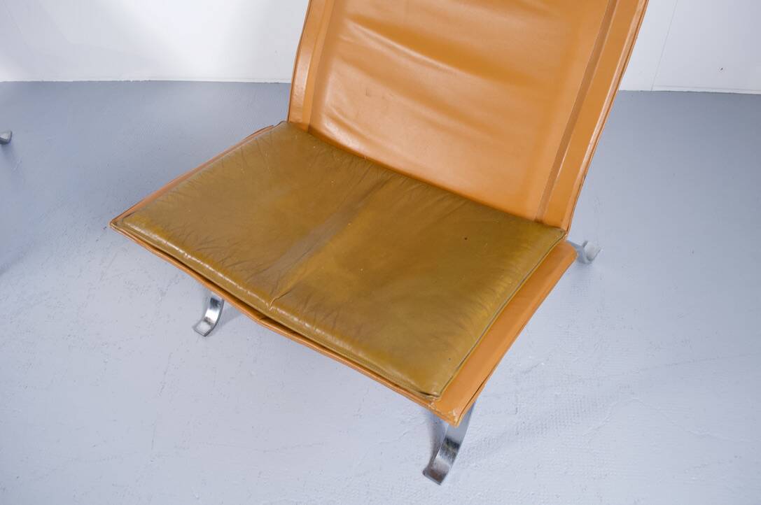 Imposing pair of leather and steel armchairs from the 1960s