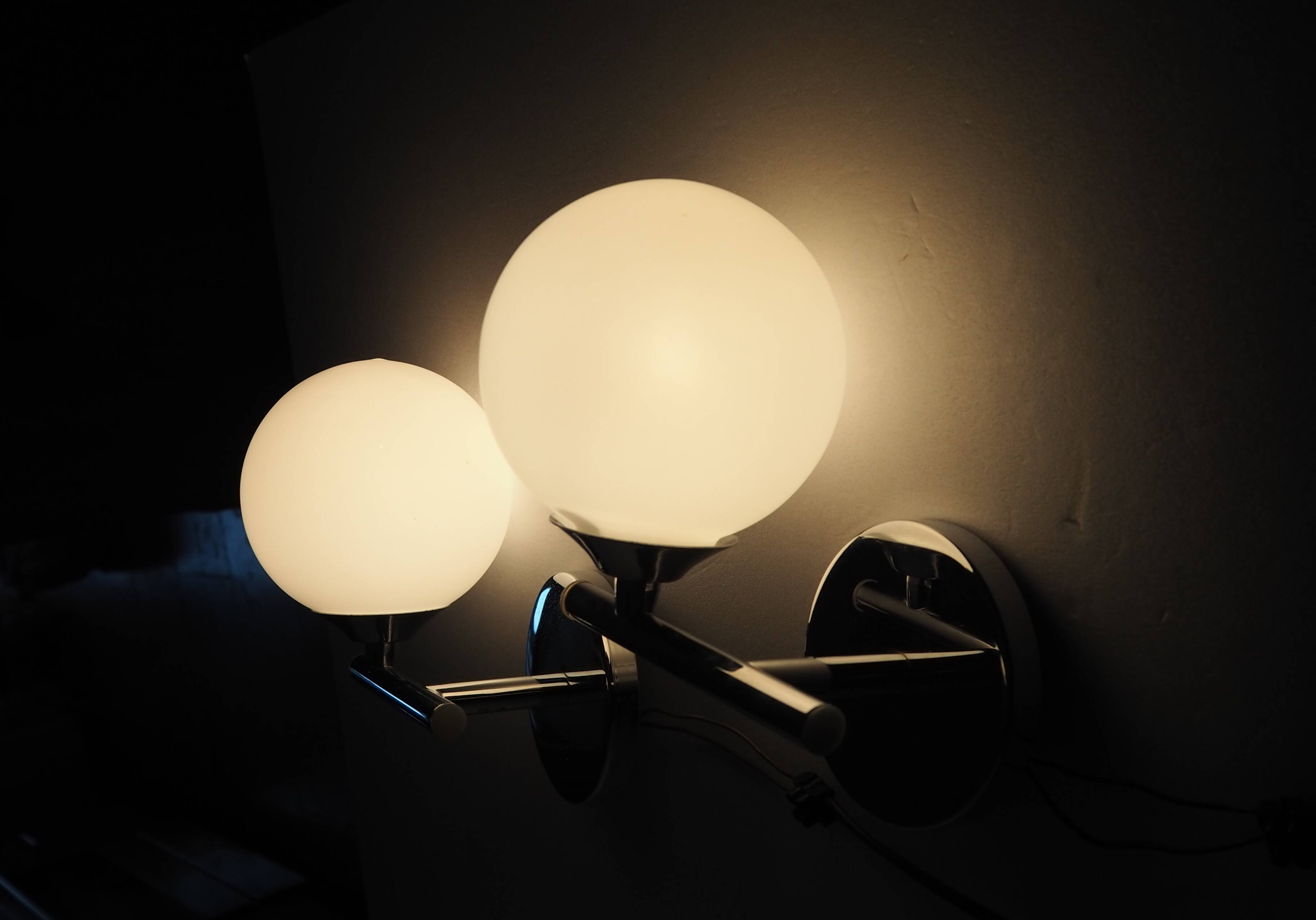 Pair of sconces with an opaline globe and chrome structure from the 1970s