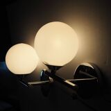 Pair of sconces with an opaline globe and chrome structure from the 1970s