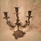 Antique metal candlestick with three branches