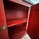 Low red "Guérande" buffet, zinc top, butcher's fridge-style doors
