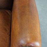 Large sheep leather wingback chair correctly finished with decorative nails