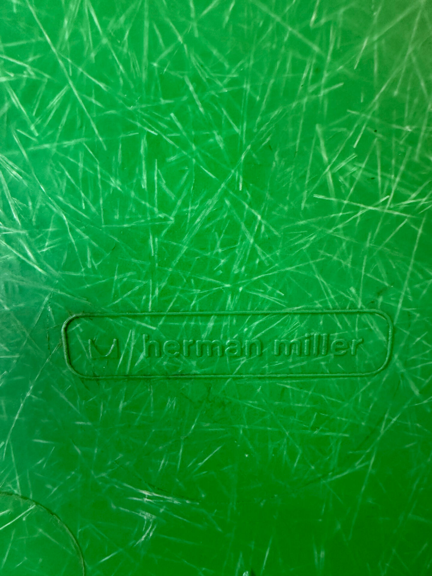 Eames Herman Miller chairs in green fiberglass.