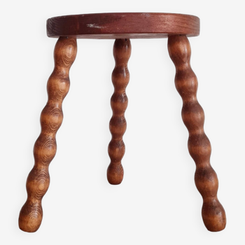 Old wooden tripod stool