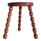 Old wooden tripod stool
