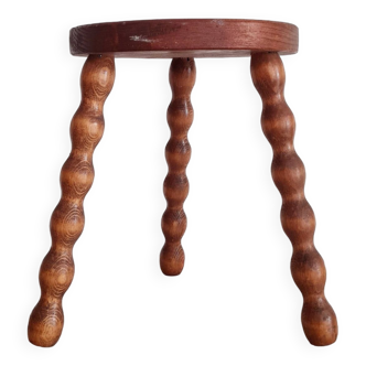 Old wooden tripod stool