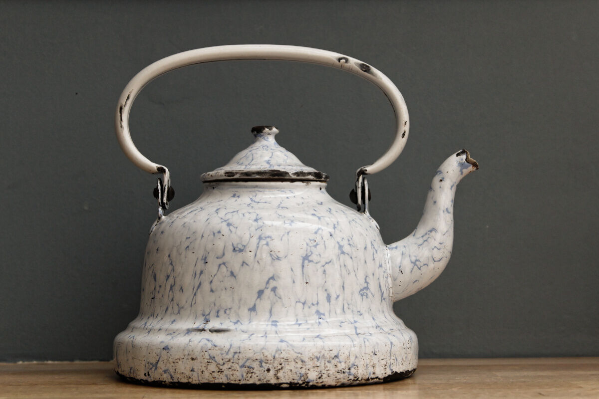 Old enamelled sheet metal kettle