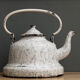 Old enamelled sheet metal kettle