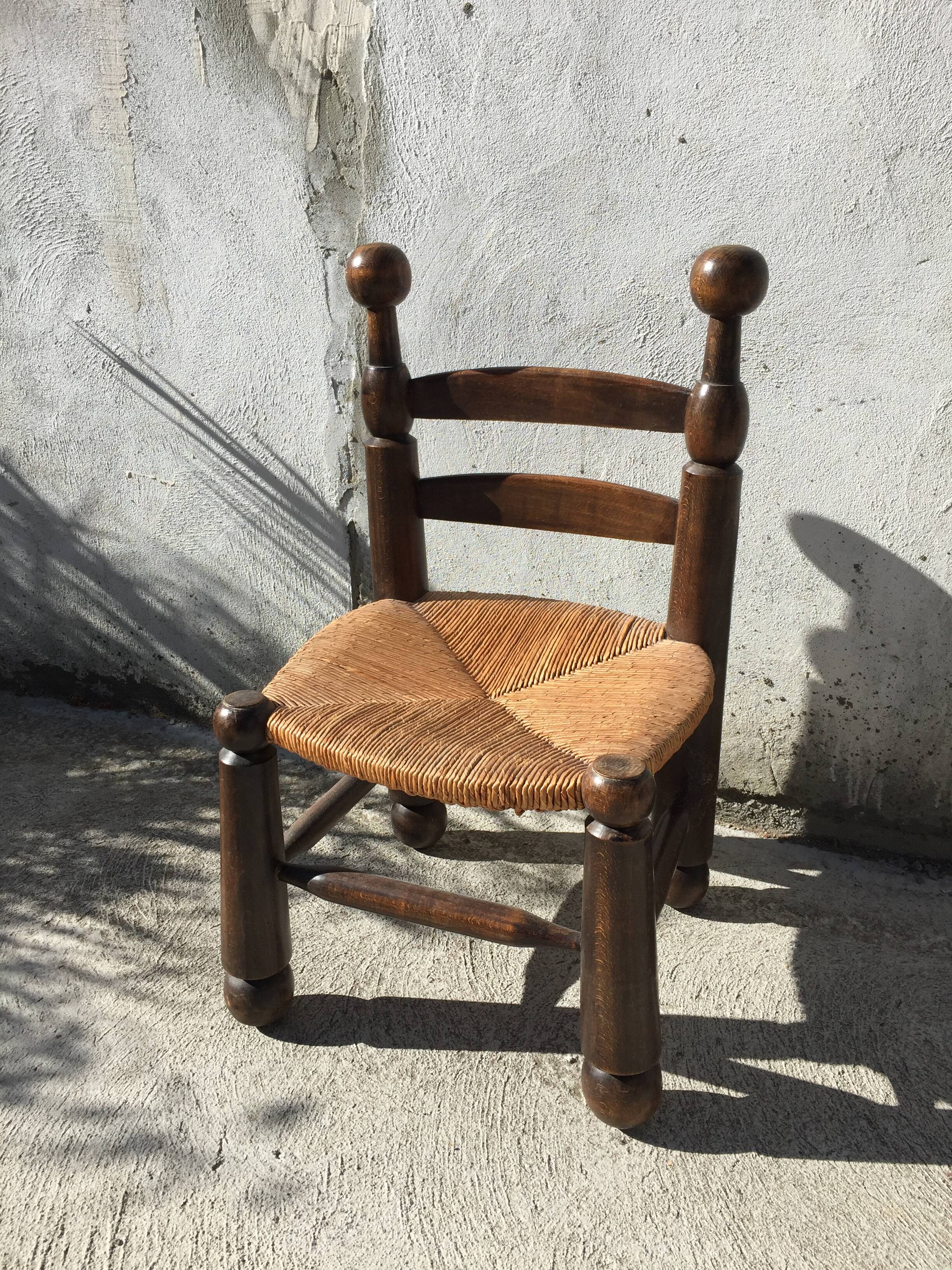 Straw low chair in the style of Charles Dudouyt