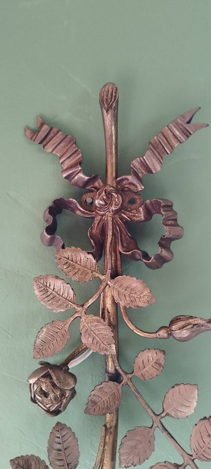 Bronze and gilded metal wall sconce in Louis XVI style.