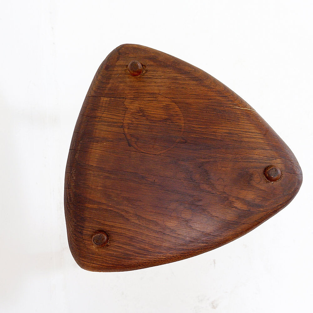 Rustic tripod stool with a triangular seat, 1960s.