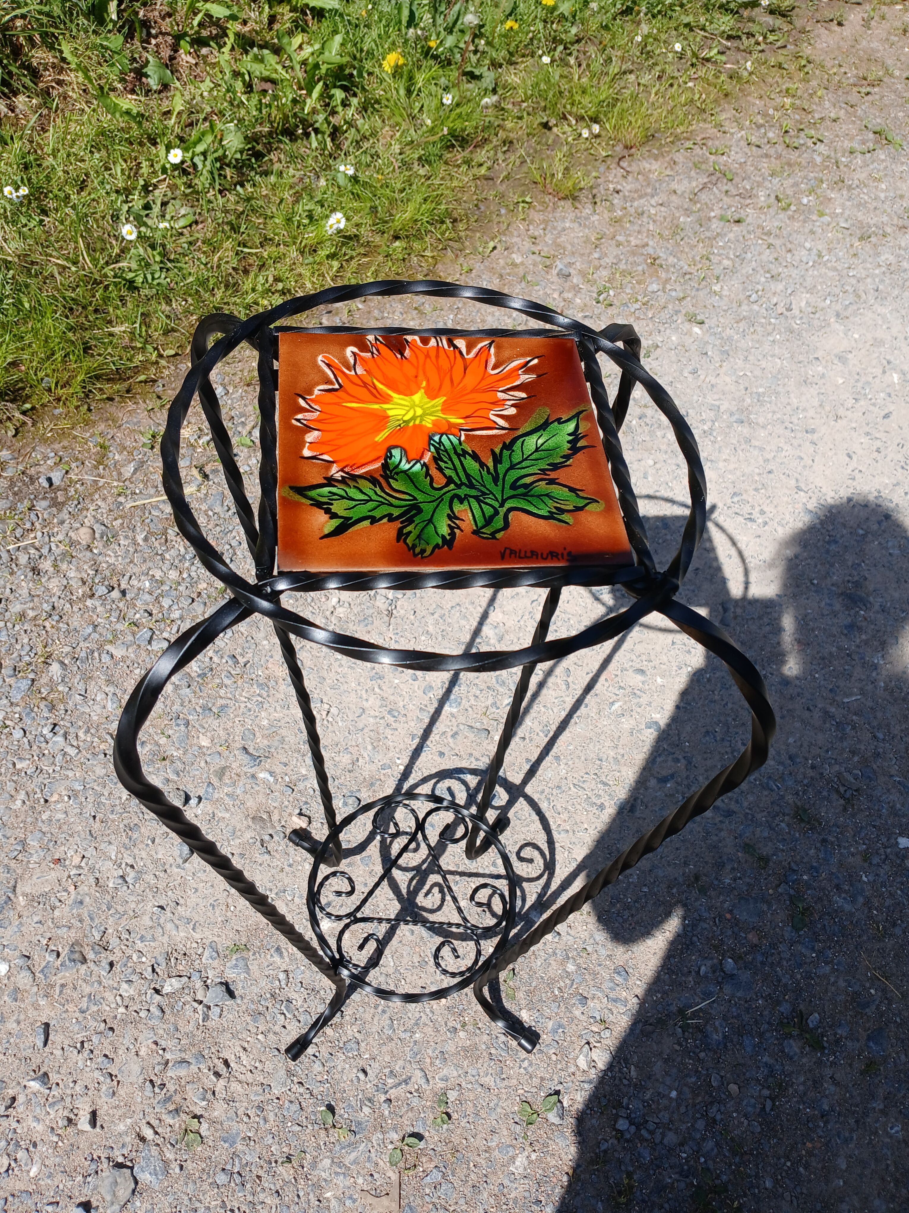 Vintage plant stand with Vallauris pottery.
