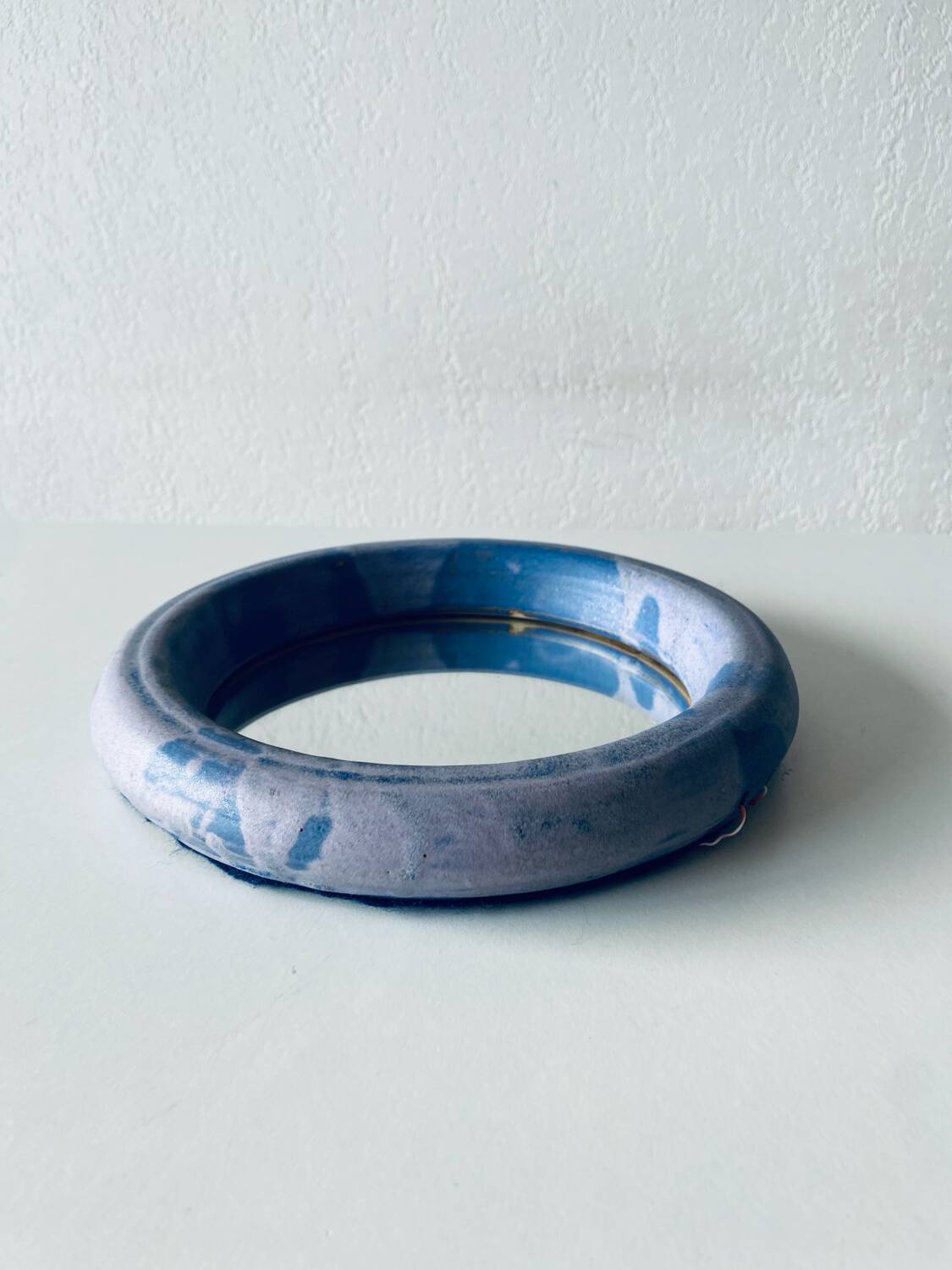 Round ceramic wall mirror