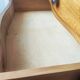 Pair of Art Deco curved bedside tables in light wood.
