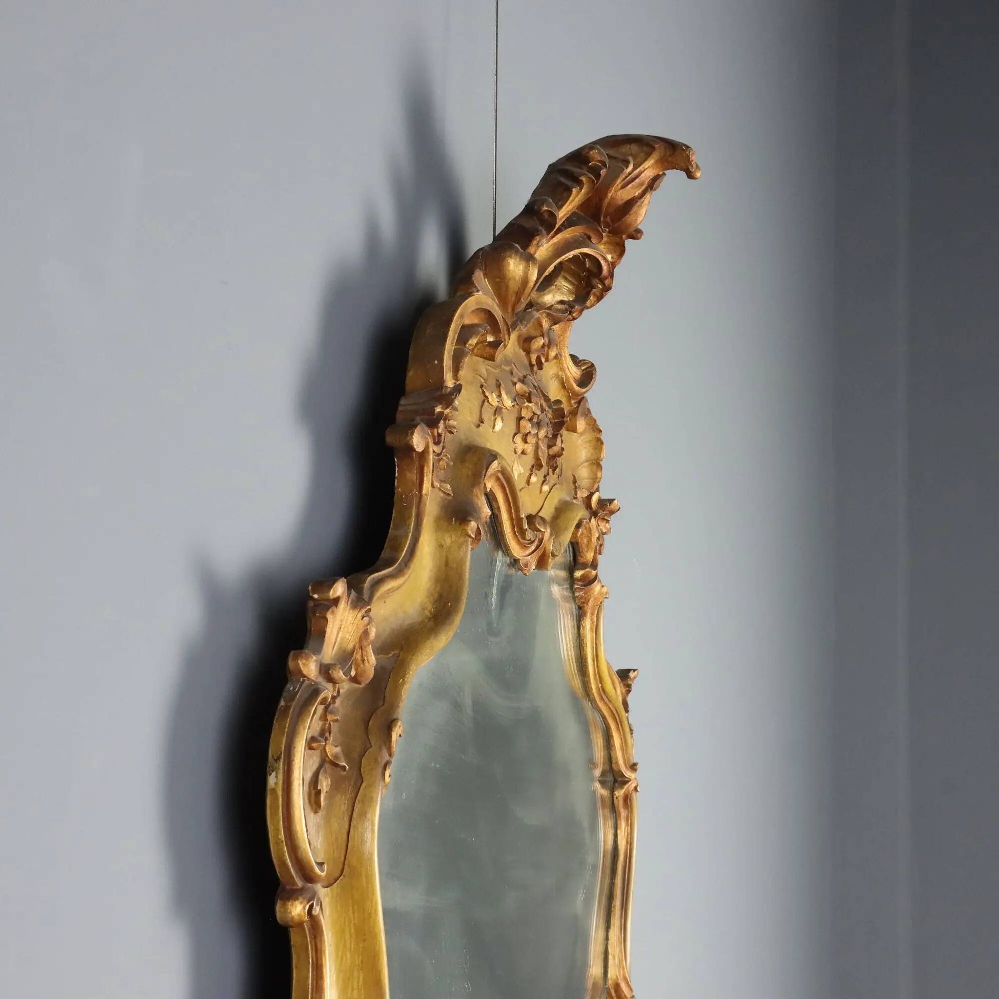 Antique baroque-style mirror in gilded carved wood, Italy 19th century.