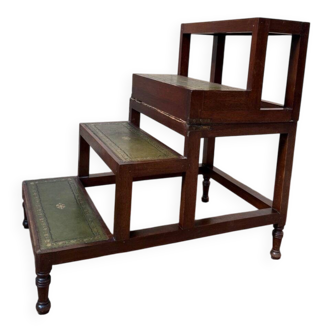 19th-century English library staircase, green leather with gold detailing.
