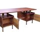 Vintage 1950s teak desk by designer Jacques Hauville.