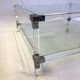 Coffee table in plexiglass, brass and glass top, 1980.