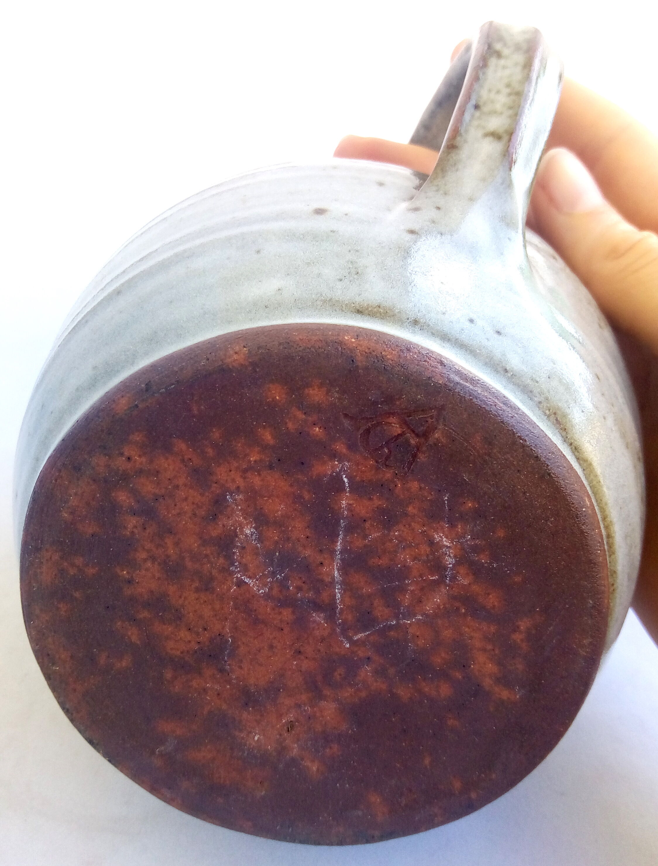 Sarthois pitcher in grey sandstone and rust effect