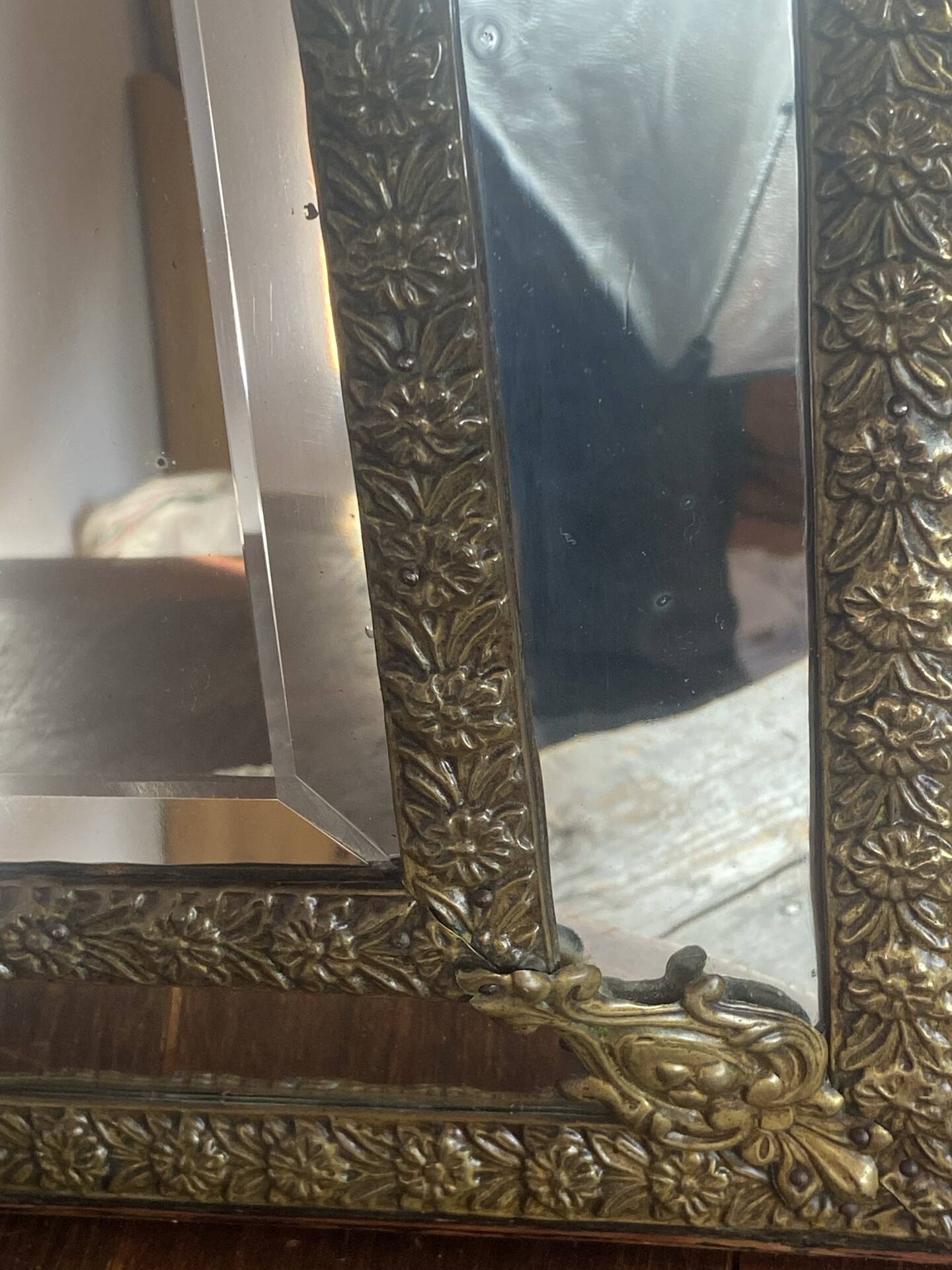 Mirror with brass repoussé frame