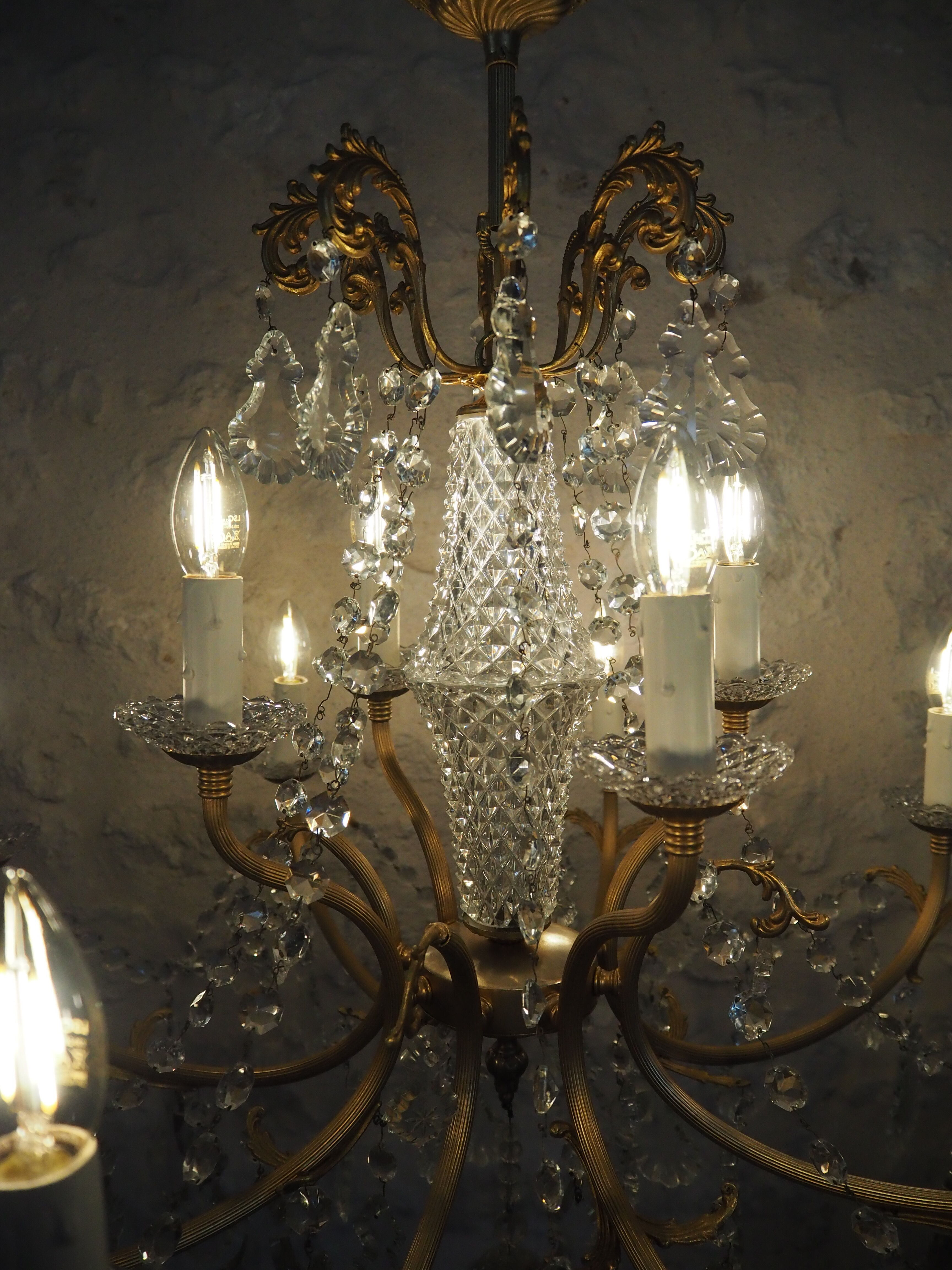 Chandelier 12 lamps with grapevines in crystal, bronze and regulated